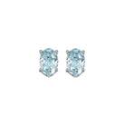 oval prong set aquamarine studs in 14k white gold