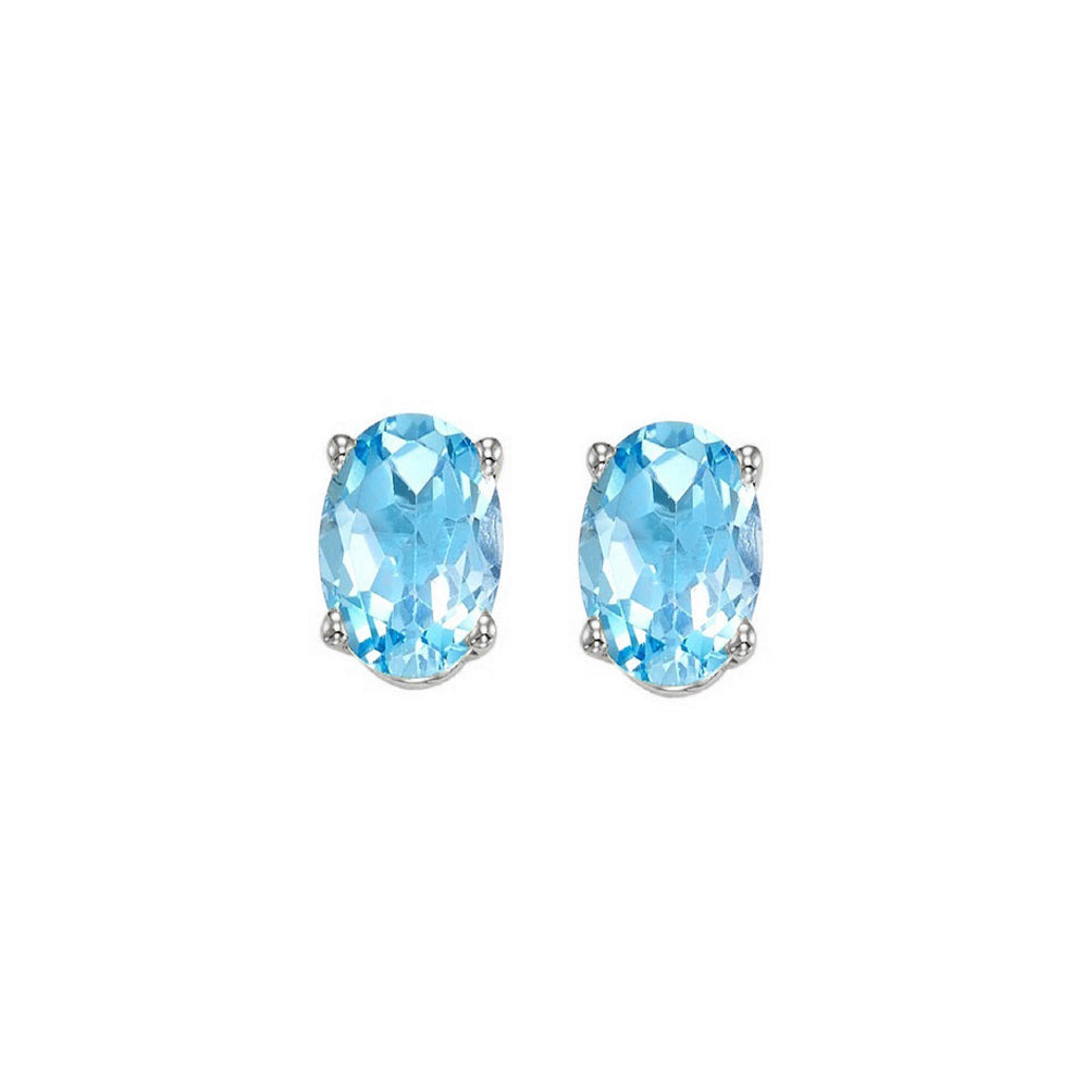 oval prong set blue topaz studs in 14k white gold