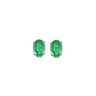 oval prong set emerald studs in 14k white gold