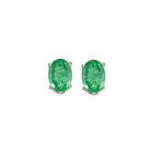 oval prong set emerald studs in 14k white gold