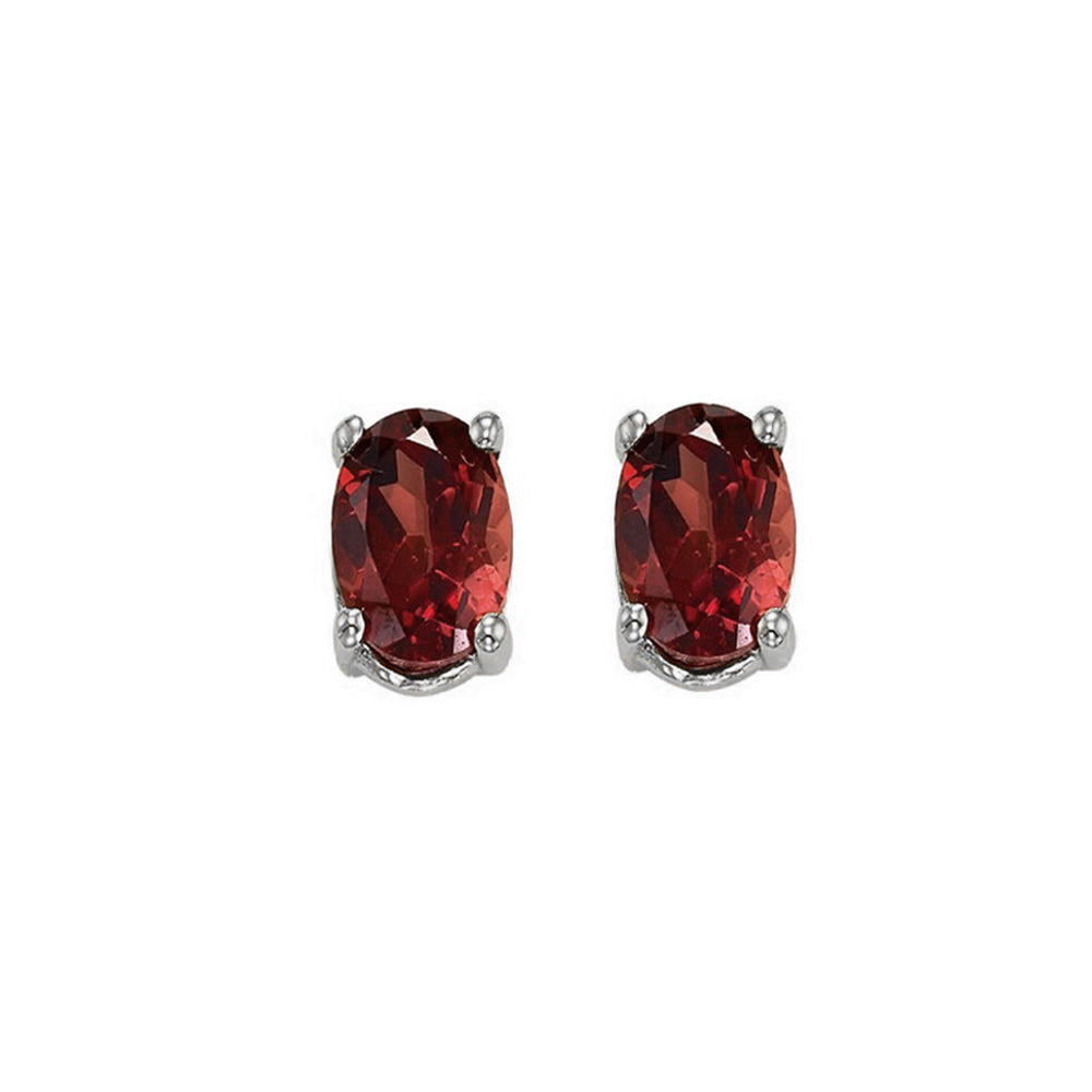 oval prong set garnet studs in 14k white gold